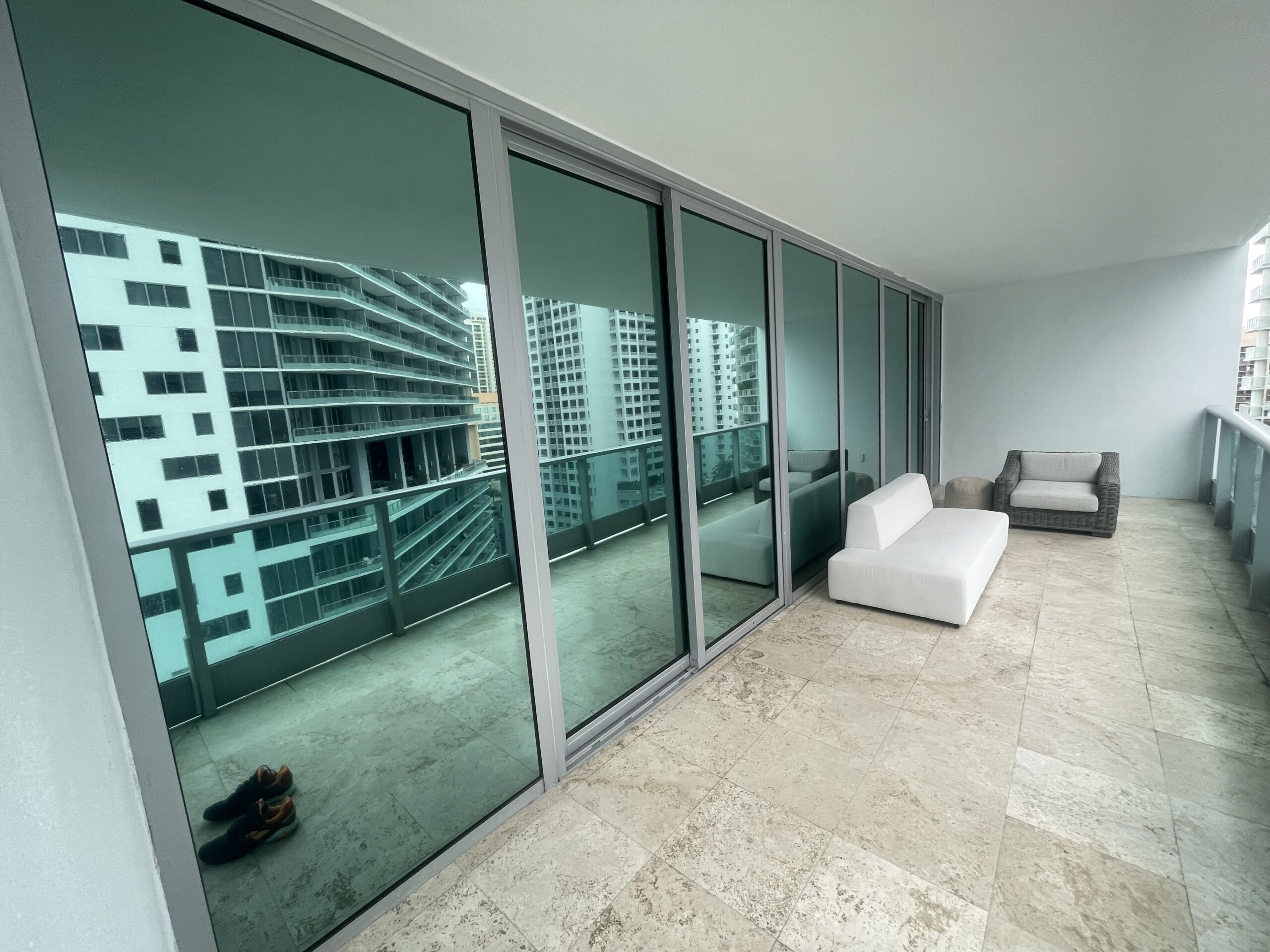 Reflective solar film on a Miami high-rise balcony